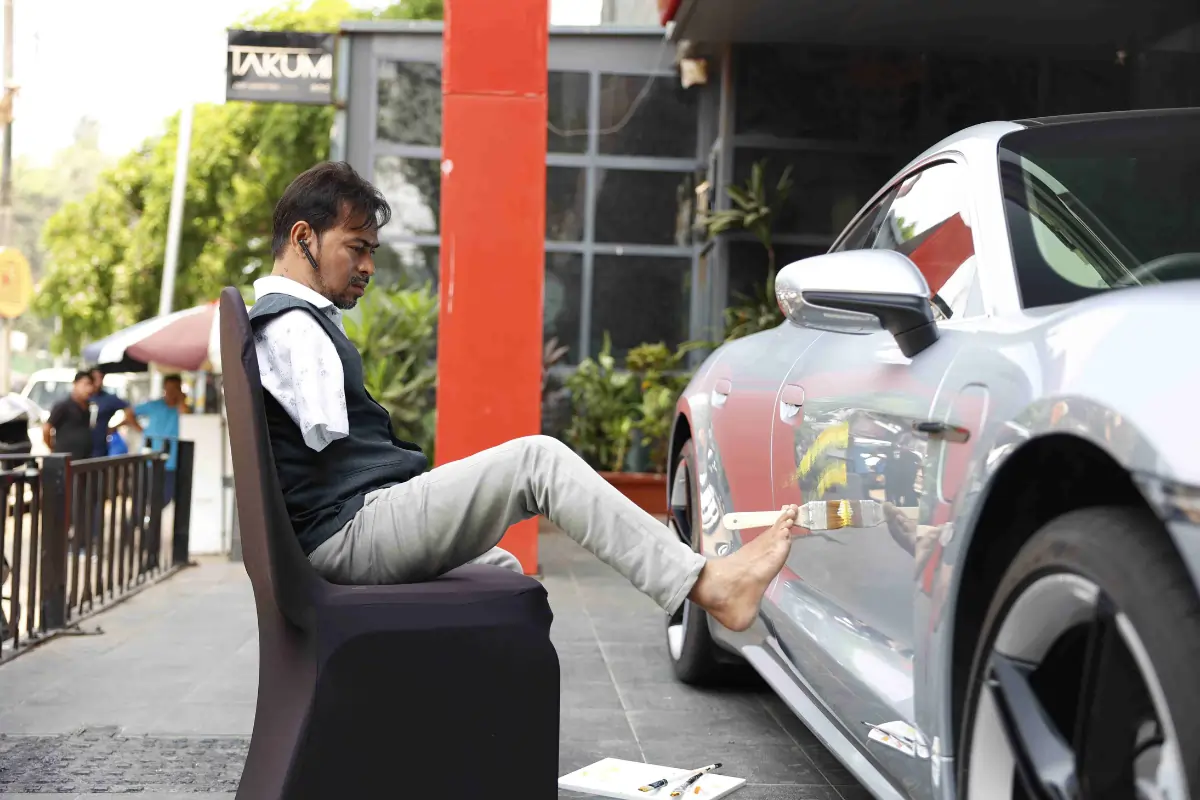 Artist Painting on Porsche - Porsche Centre Mumbai